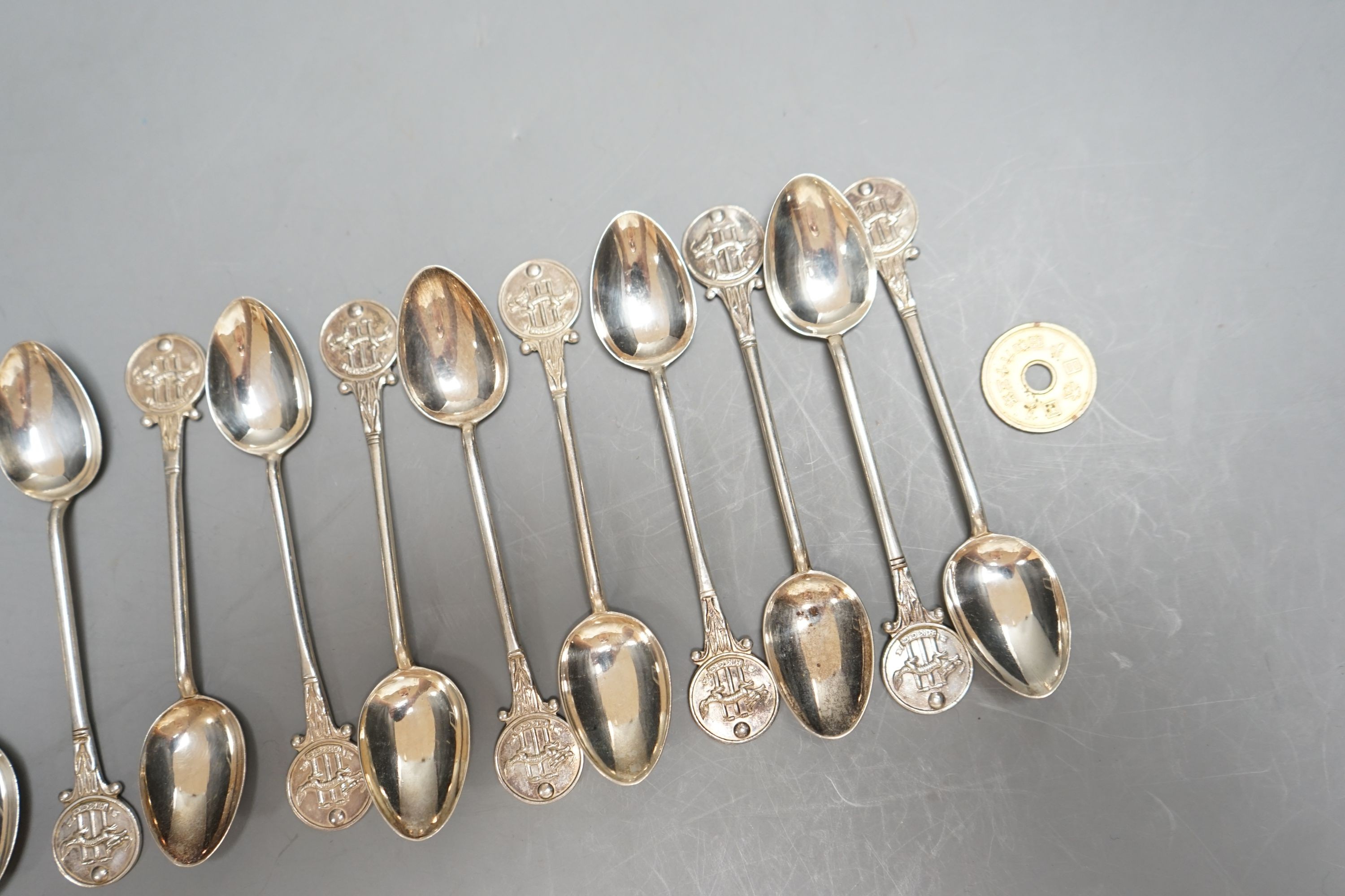 A set of seventeen early 20th century 'Hong Kong Cricket Club' coffee spoons, 10.6cm, 168 grams.